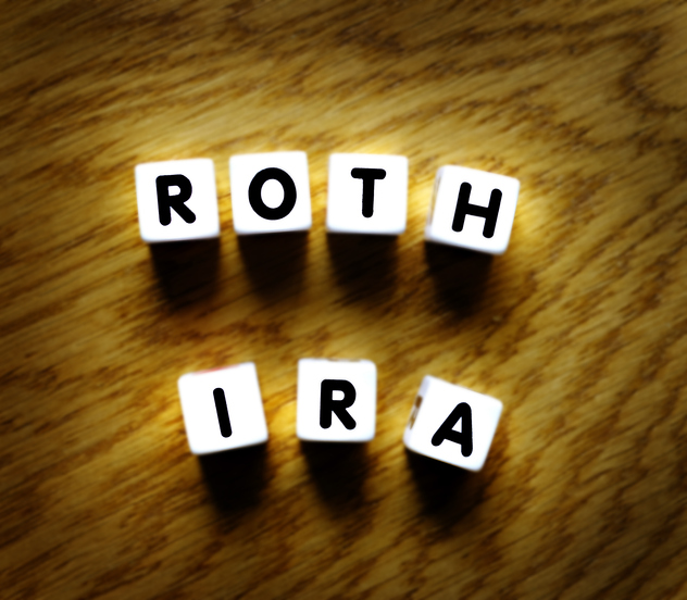Roth IRA spelled out with dice for retirement planning and savings investments.
