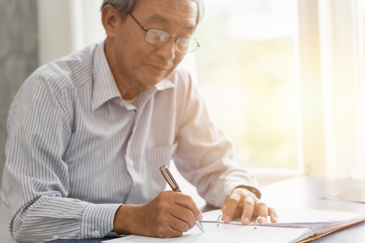 A senior making adjustments to his retirement plan.