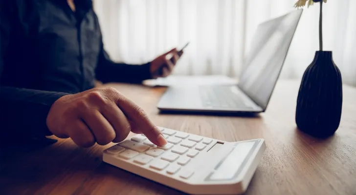 Closeup of an investor evaluating stock investments.