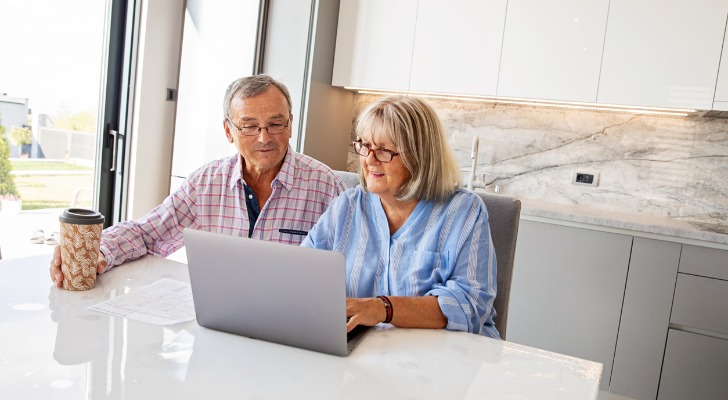 A couple reviewing their investment portfolio.