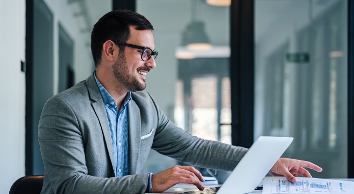 A financial advisor reviewing an email template for target clients.
