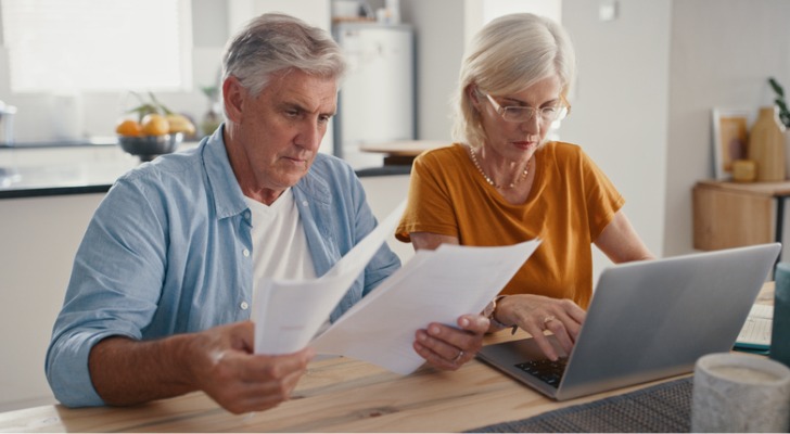 A senior couple reviewing their retirement plan.