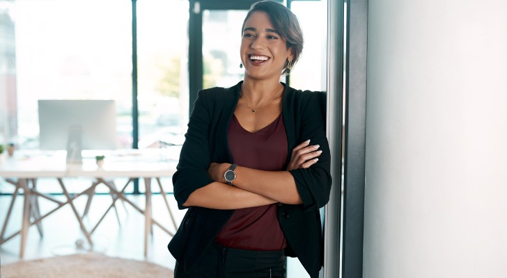 A financial advisor welcoming prospective clients to an event.