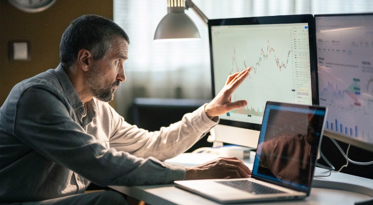 An investor comparing Nasdaq and S&P 500 performance.