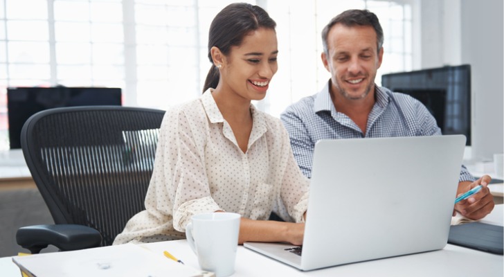 A couple comparing investments in a Roth IRA.