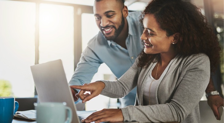 A couple deciding between Nasdaq and S&P 500 investments.