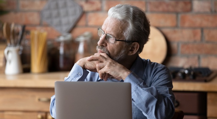 An investor thinking about the benefits and drawbacks of investing in stocks.