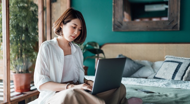 A woman reviewing her investment portfolio.
