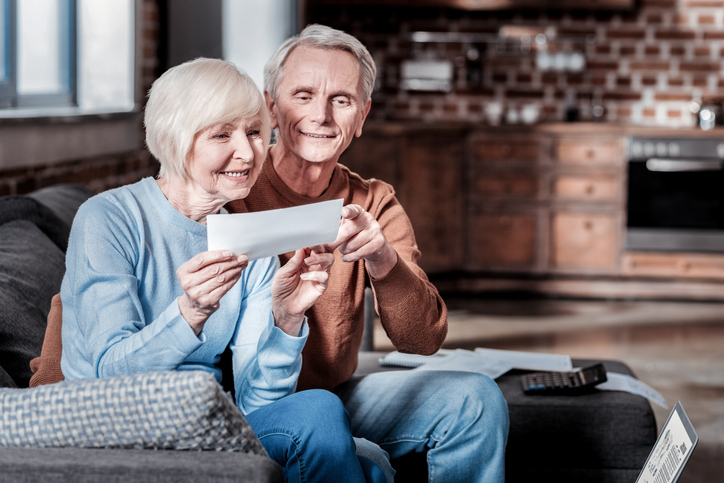 A senior couple reviewing their Social Security check.