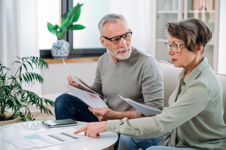 A senior couple reviewing their estate plan.