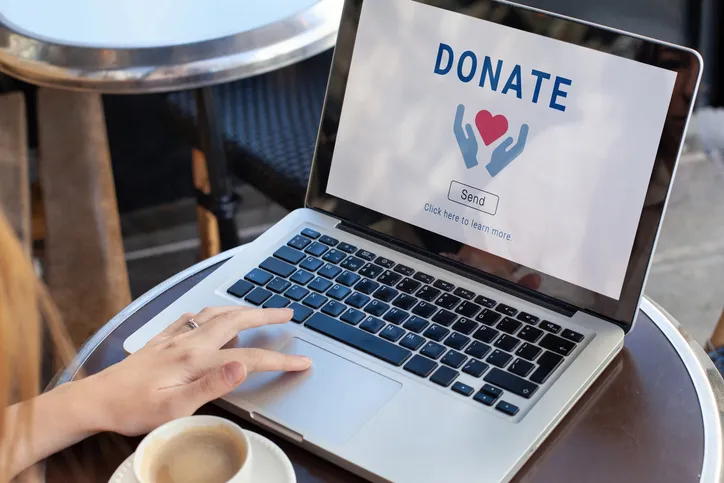 A person making a charitable donation online.