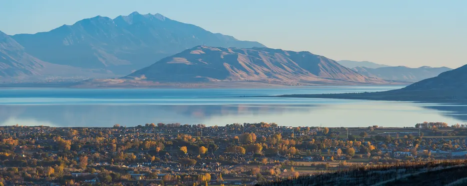 Southerly view of Utah Lake with Lehi neighborhoods below and West Mountain then Mount Nebo above