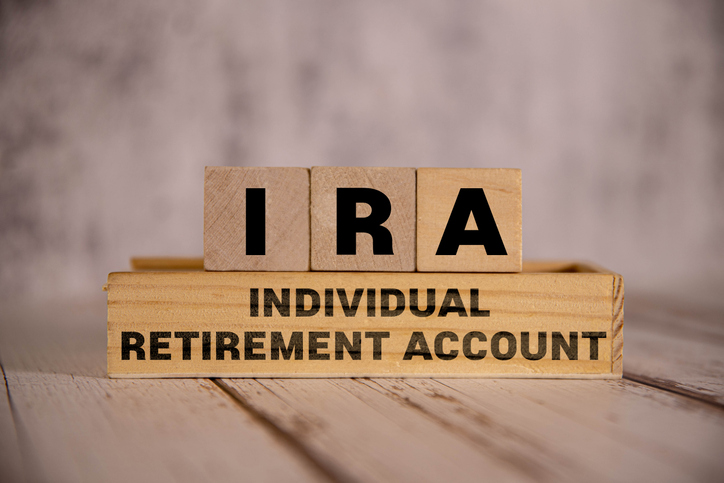 Wooden blocks with the text "IRA Individual Retirement Account" printed on them.