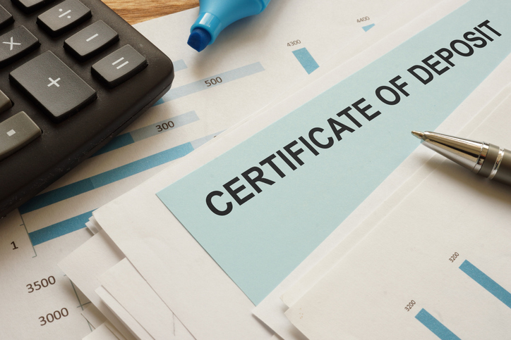 A certificate of deposit (CD) is shown as part of a conceptual photo.