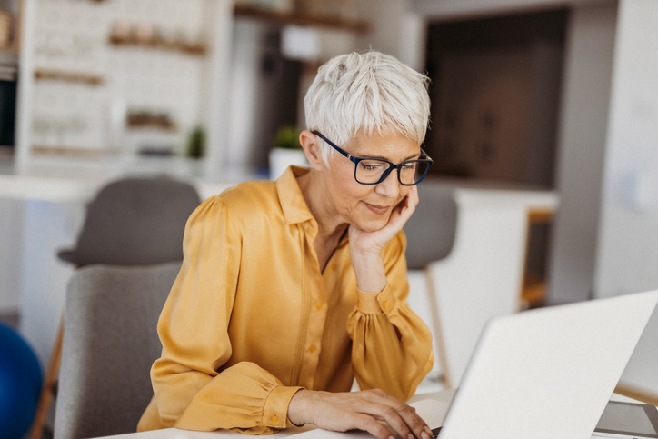 A woman comparing different annuity contracts.